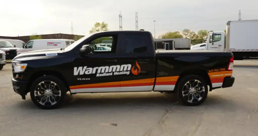 Warmmm truck decals on the driver side of their company truck.
