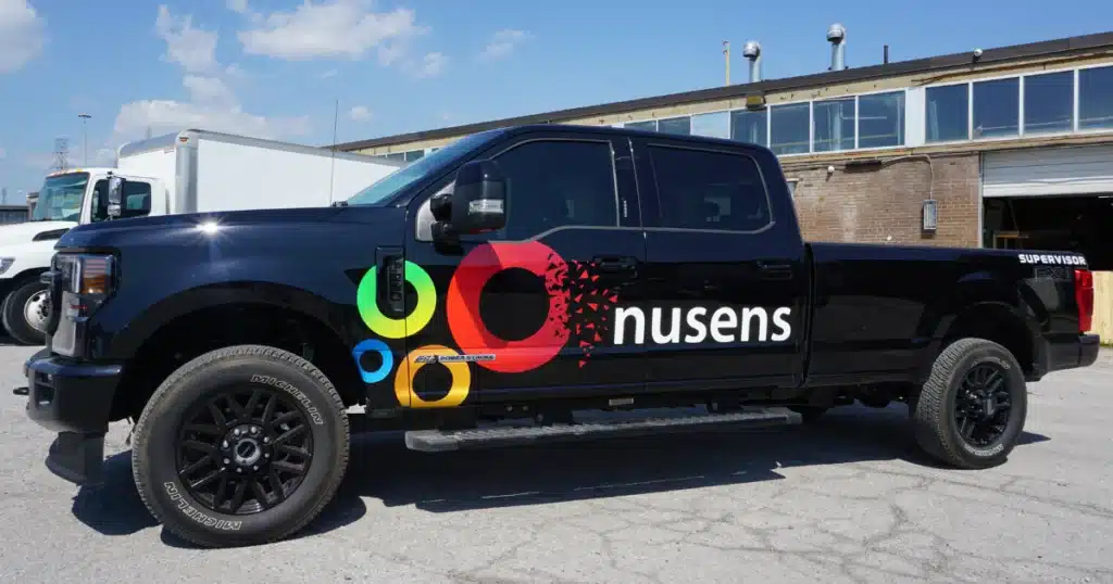 Nusens Ford F150 truck decals after the installation outside of Vinyl Wrap Toronto, driver side view.