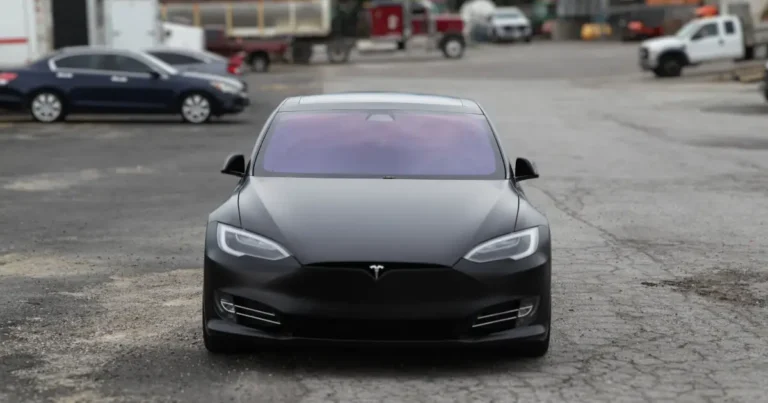 A front view of a Tesla Model S with a custom matte finish vinyl wrap