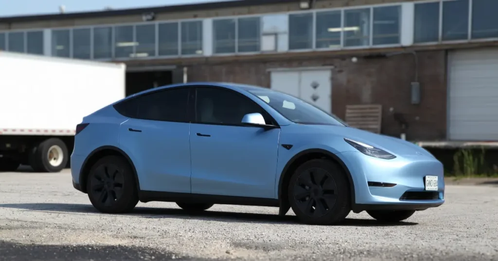 Side view of a Tesla Model Y featuring a full wrap