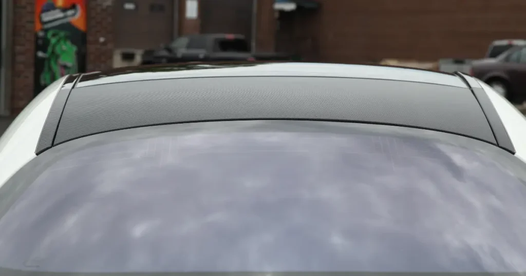 Close-up angle of a Mercedes S63 Partial Wrap displaying Black Carbon Car roof