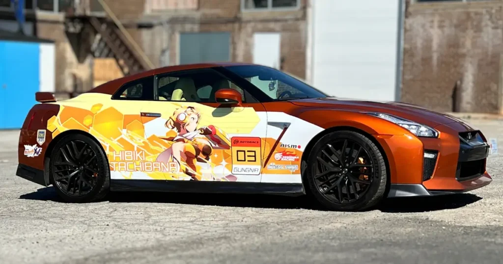 This Nissan GTR showcases a bold Symphogear-inspired partial wrap featuring Hibiki Tachibana